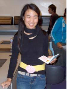 Girl wearing the prototype and holding a phone in her hand