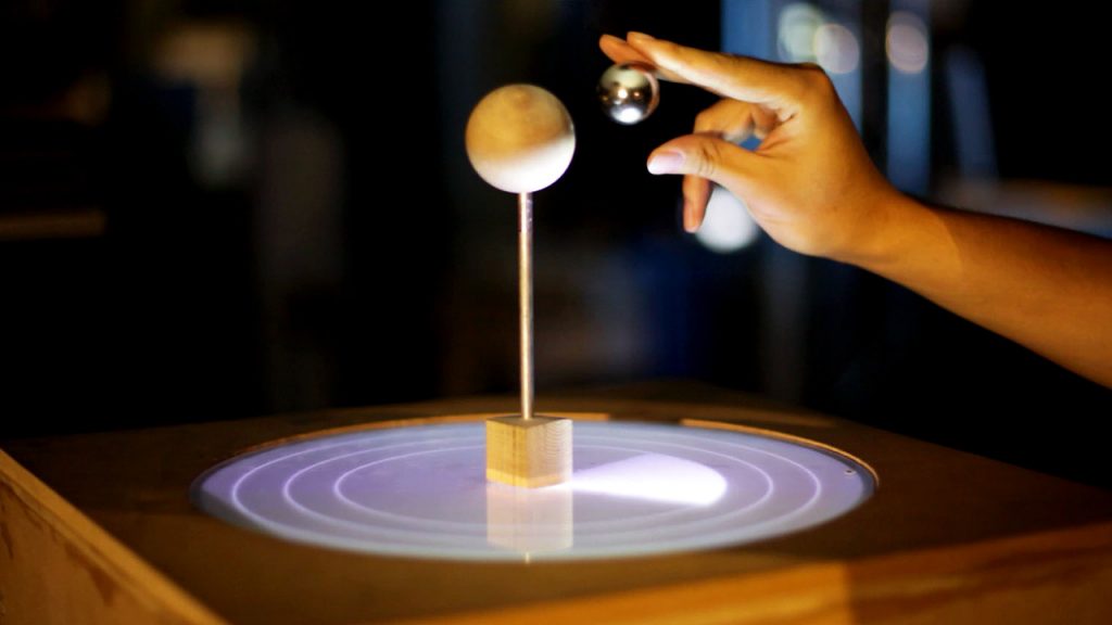 A levitating ball, serving as output and input device.