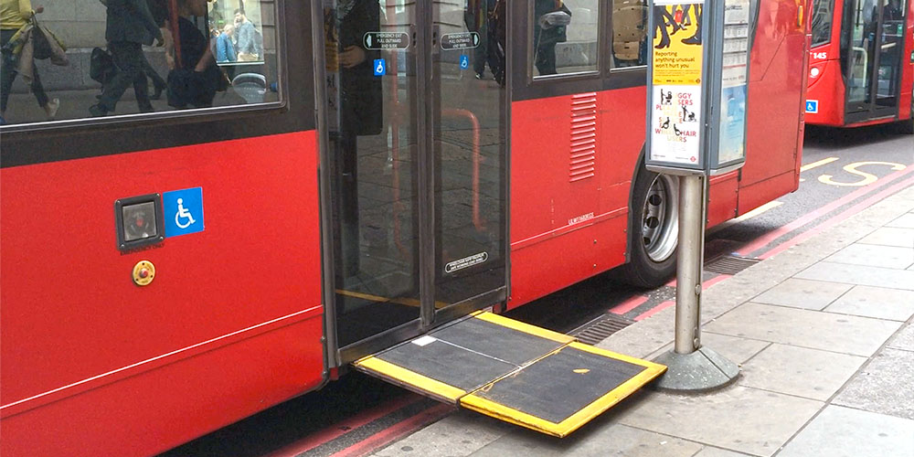 An automatic bus ramp is blocked by a bus stop.